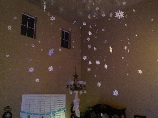 20 foot ceilings dripped with frozen inspired snow storm. Die cut snowflakes falling all around