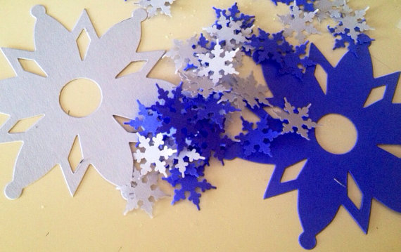 Large and small snowflake die cuts...perfect for a Frozen party do it yourself diy decoration in shades of blue and white...